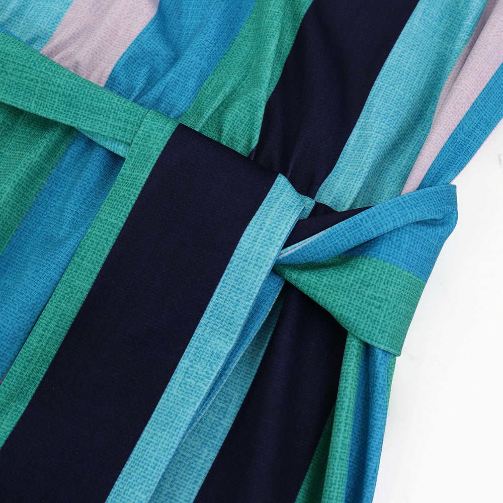 Elegant Striped Maxi Dress with Ruffle Sleeves and Lace-Up Detail in - by Malbusaat