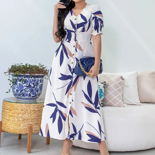Elegant V-Neck Slimming Dress with Button and Puff Sleeves in - by Malbusaat