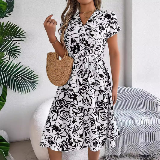 Elegant Floral Swing Dress in - by Malbusaat