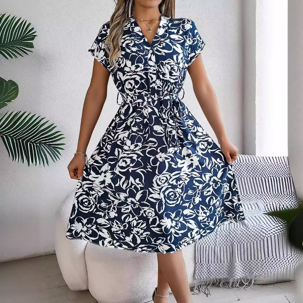 Elegant Floral Swing Dress in - by Malbusaat