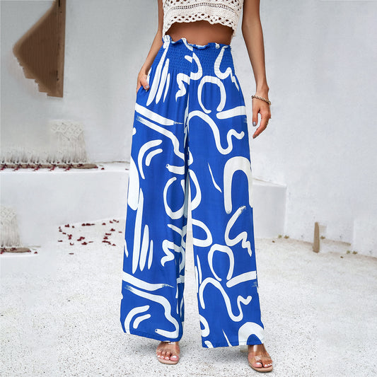 Abstract Print Smocked Waist Wide Leg Trousers in - by Malbusaat