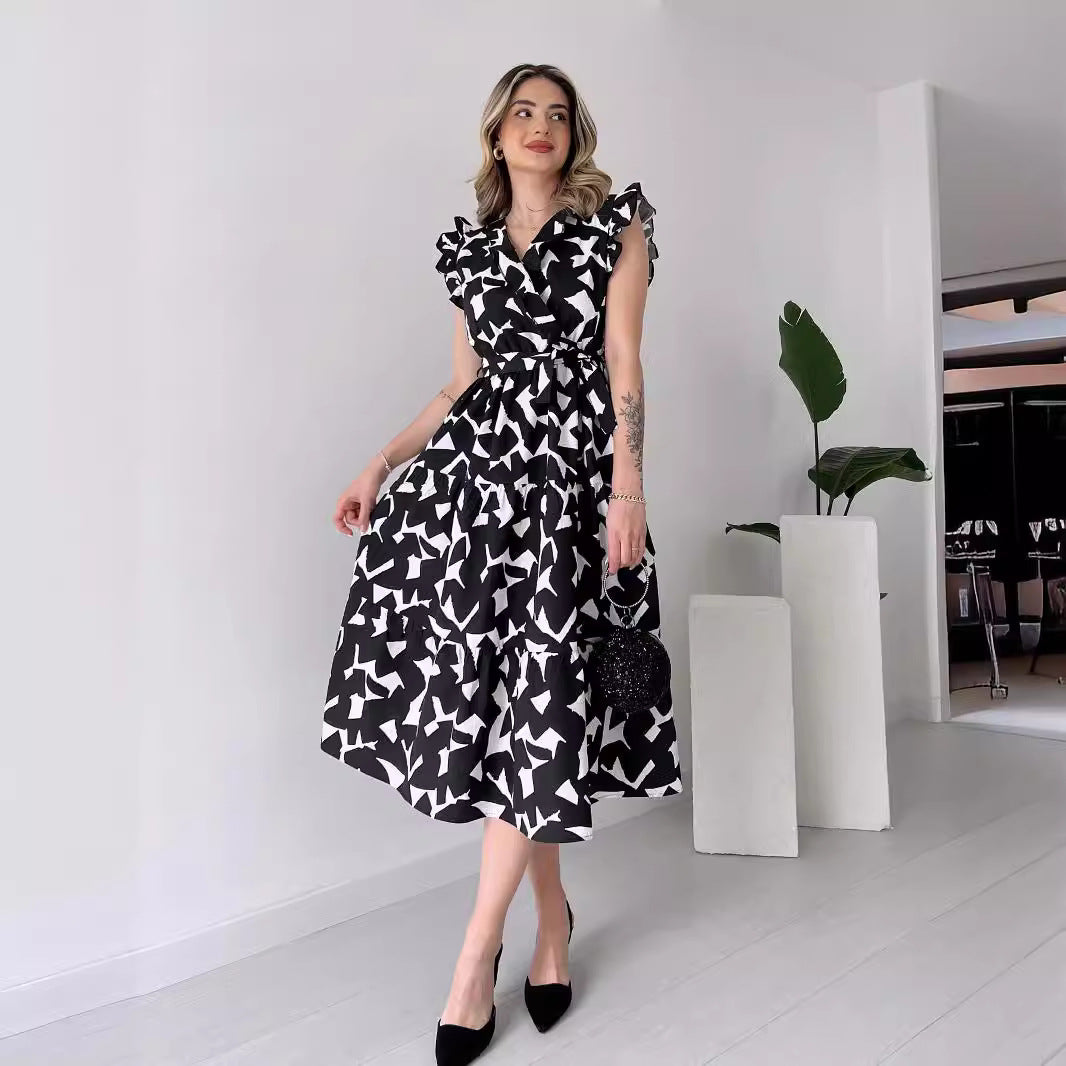 Printed V-Neck Belted Maxi Dress in - by Malbusaat