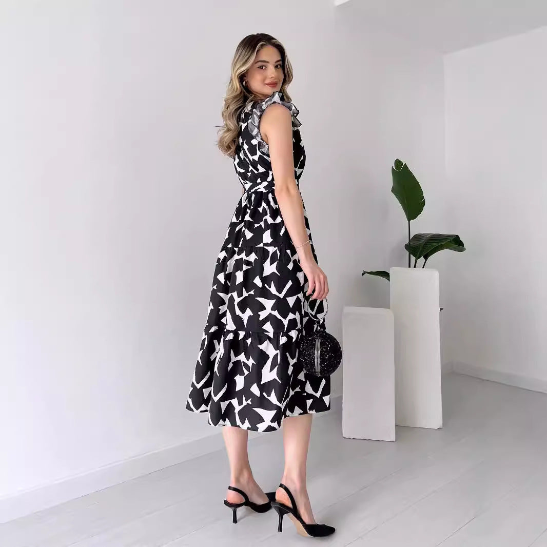 Printed V-Neck Belted Maxi Dress in - by Malbusaat
