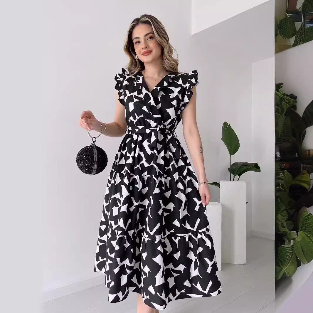 Printed V-Neck Belted Maxi Dress in - by Malbusaat