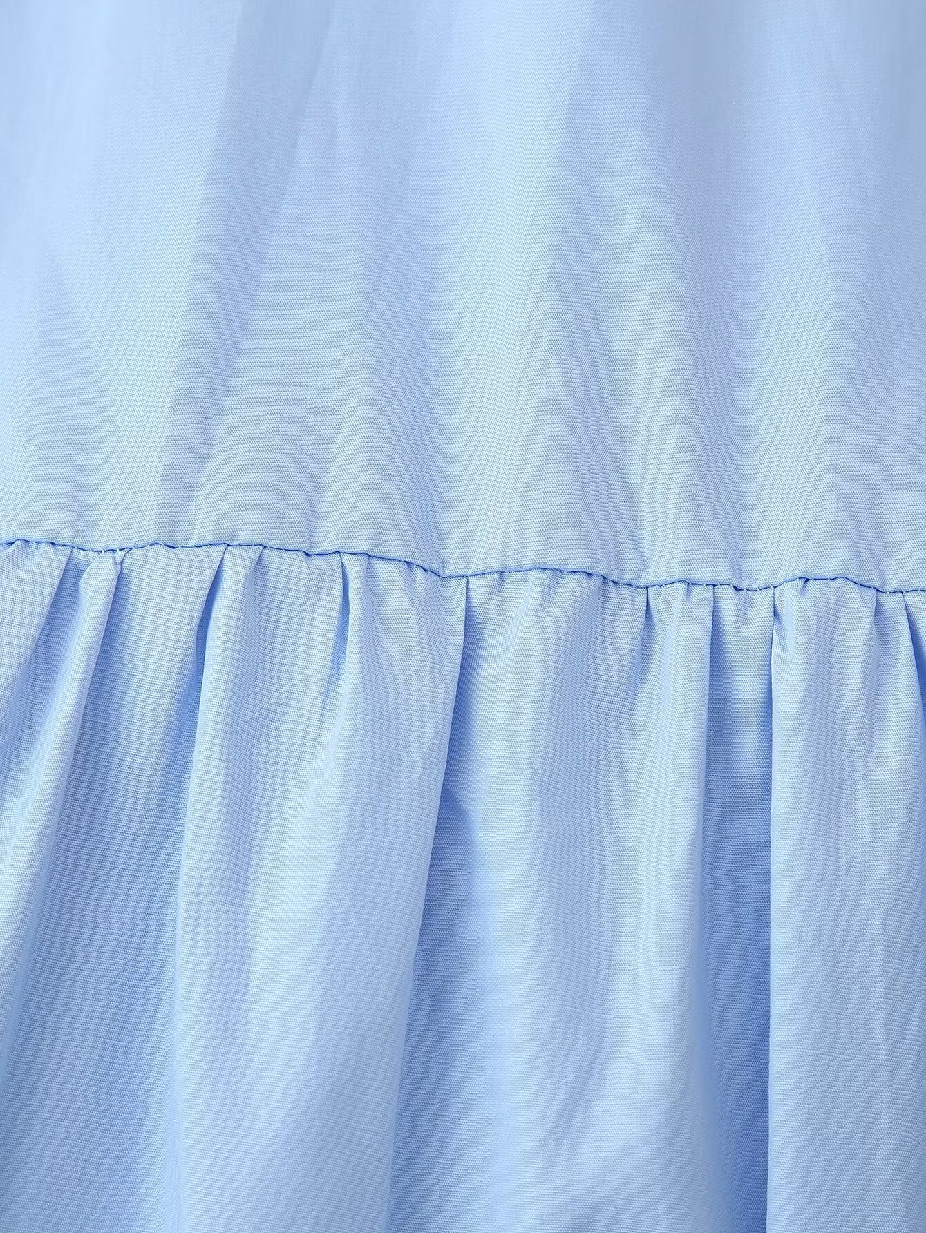 Malbusaat light blue cotton puff sleeve round neck maxi dress close up of gathered tiered skirt seam detail