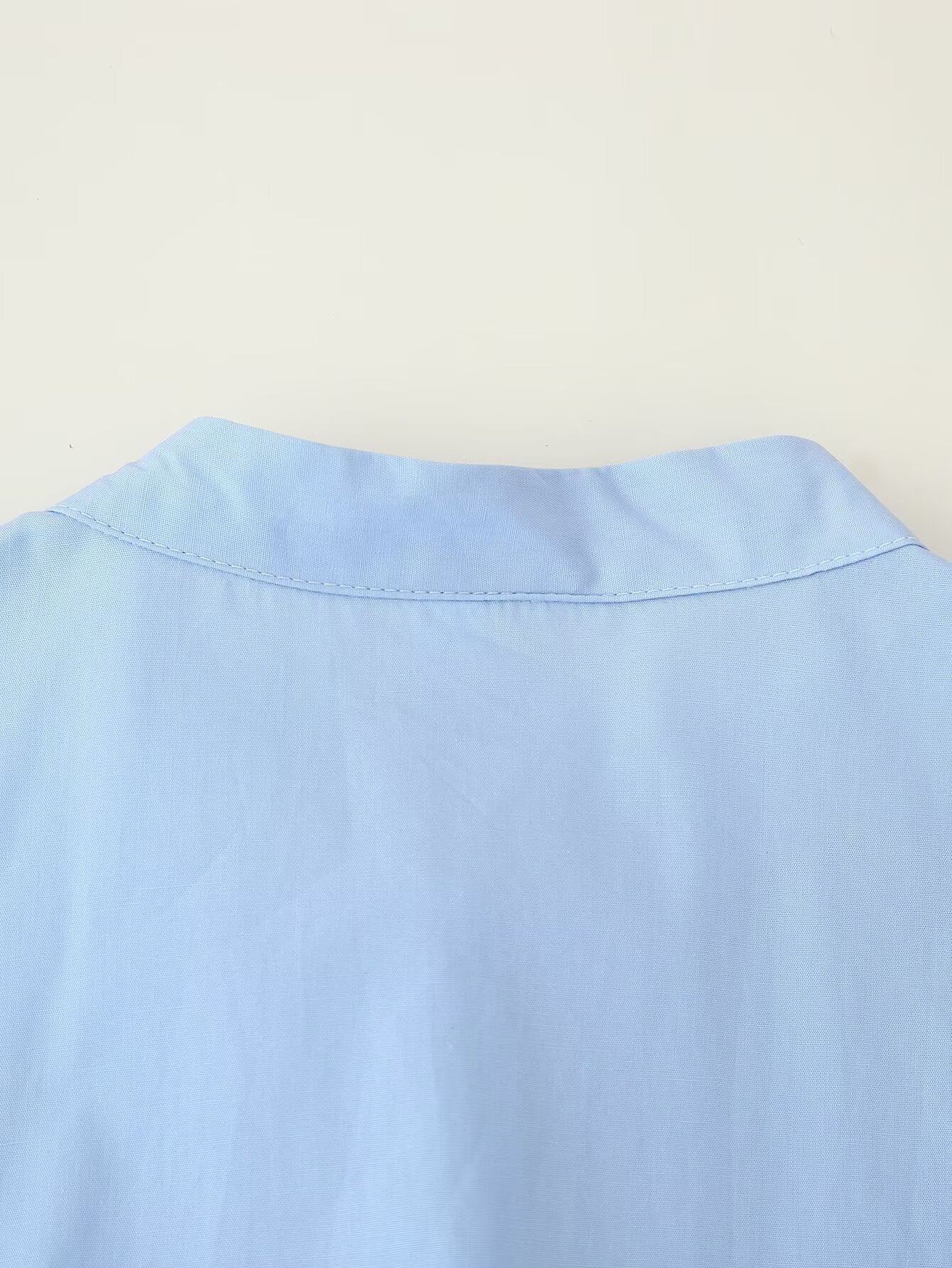 Malbusaat light blue cotton dress back neckline detail showing collar seam puff sleeve round neck maxi