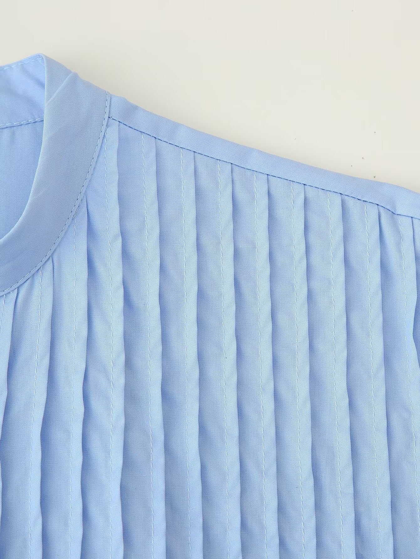 Light blue pleated cotton Malbusaat puff sleeve round neck maxi showing shoulder seam and vertical pintuck detail