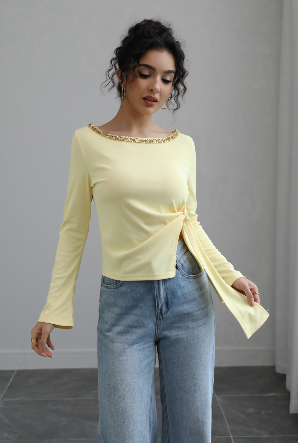 Malbusaat autumn lace up top pale yellow long sleeve boat neck with side knot tie styled with jeans