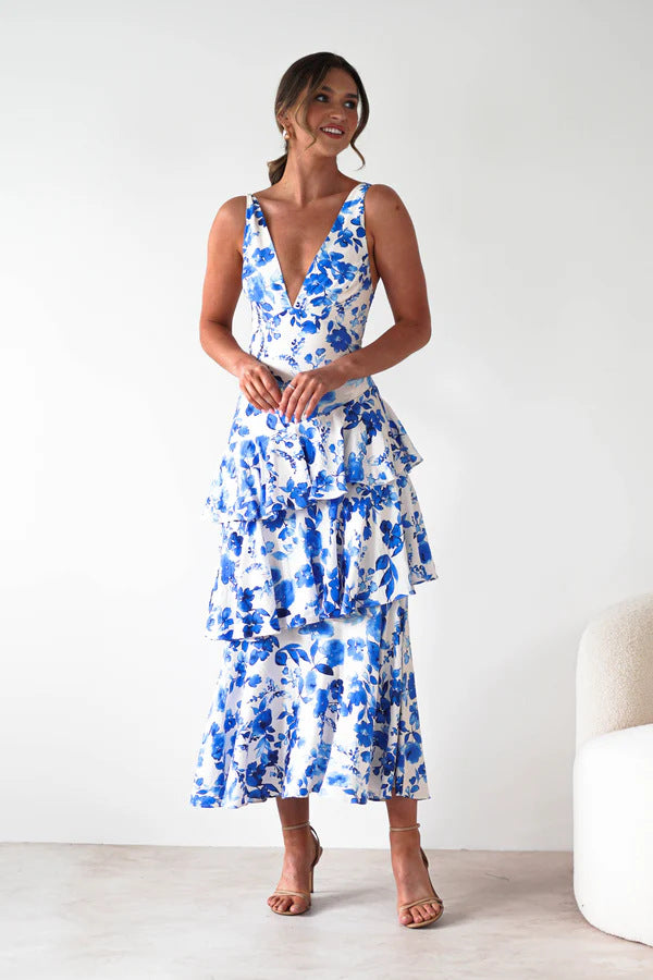 Malbusaat Backless Deep V Plunge Summer Vacation Maxi dress with blue floral print on white fabric