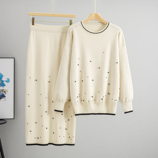 Malbusaat beaded knit co ord set featuring a soft cream jumper and matching skirt with decorative beads
