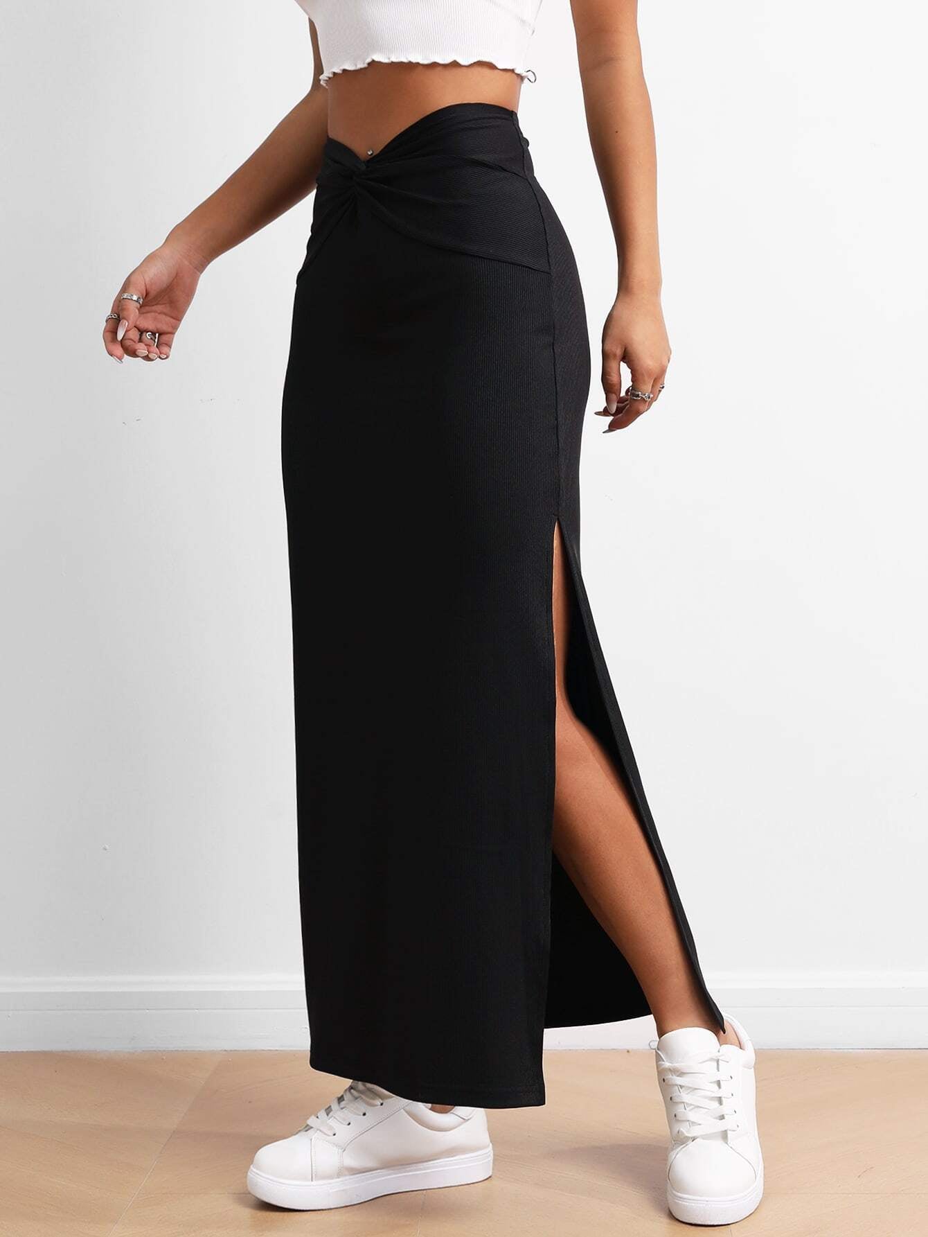 Black Malbusaat drape slit skirt with high waist and side slit worn with white sneakers