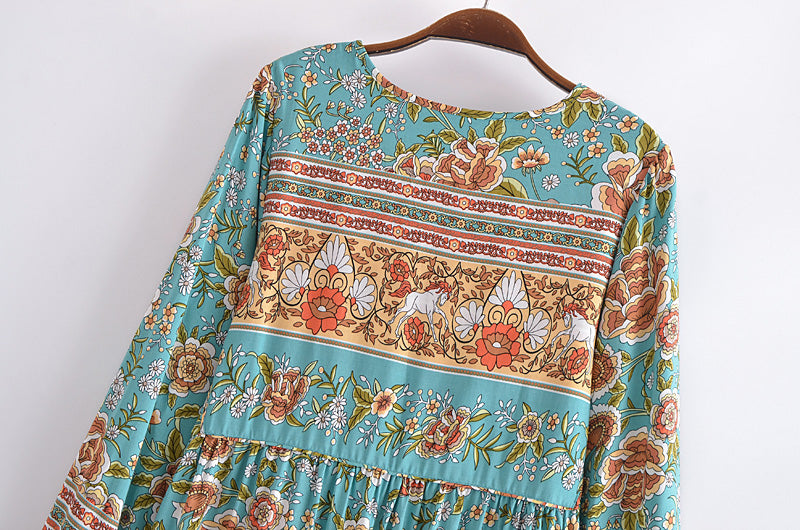 Malbusaat bohemian maxi dress for women with floral and stripe patterns on turquoise fabric
