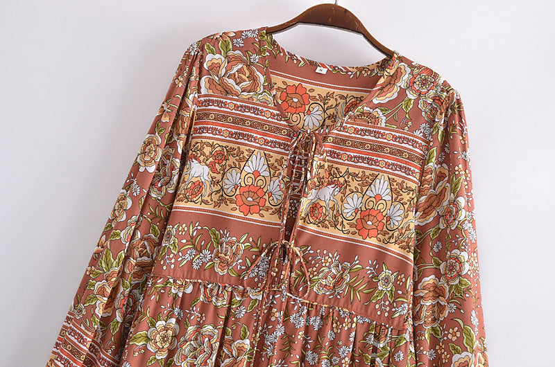 Bohemian maxi dress for women by Malbusaat with floral patterns and long sleeves in earthy tones