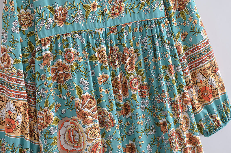 Turquoise floral patterned fabric detail of a bohemian maxi dress for women by Malbusaat