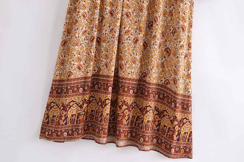 Close-up of a boho floral dress online UK featuring intricate floral patterns and camel border design