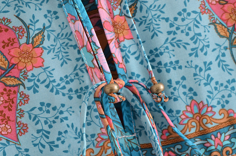 Close-up of lace detail on blue floral lace up crew neck maxi dress for women by Malbusaat
