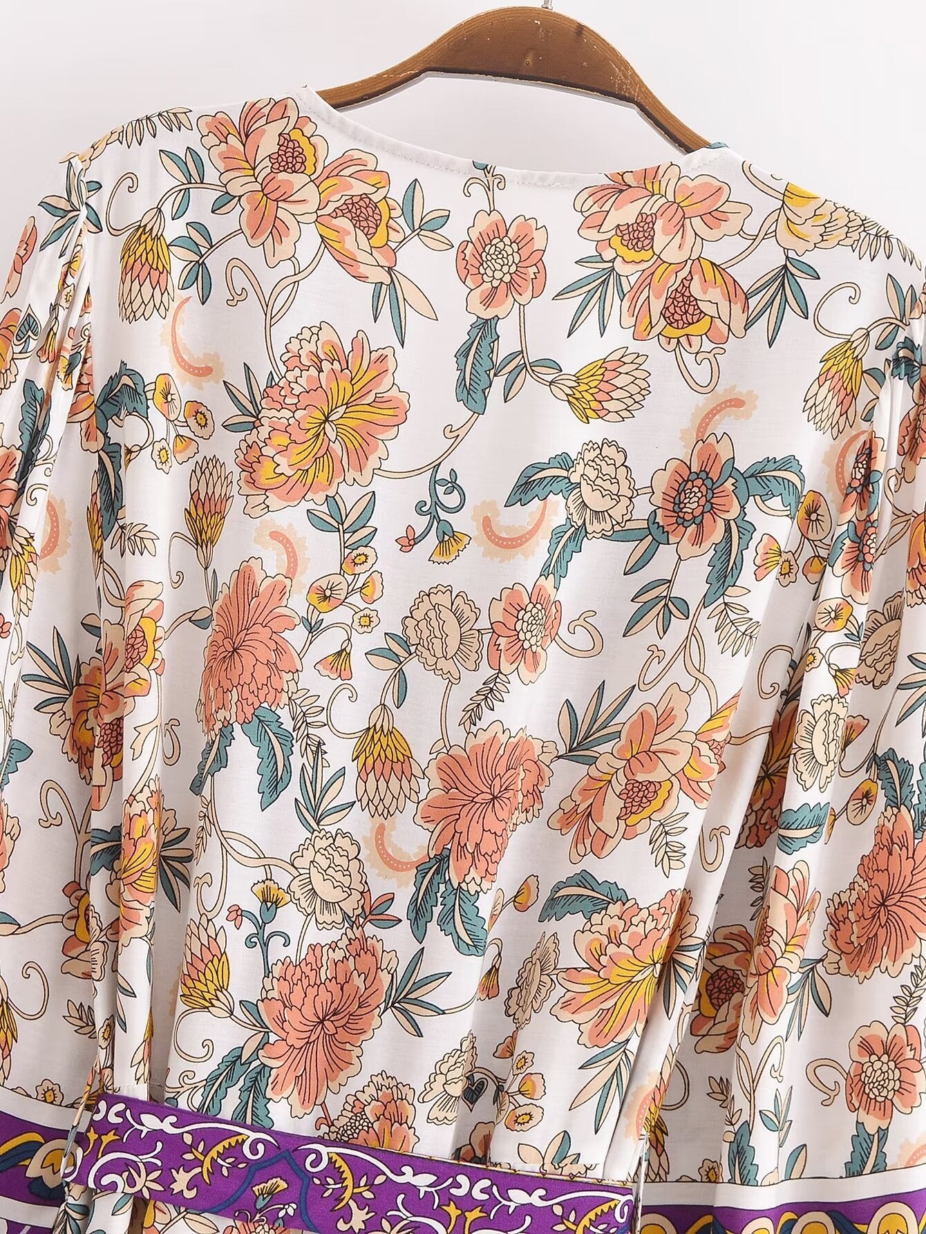 Malbusaat long sleeve floral summer dress UK with vibrant peach and yellow flowers on white fabric