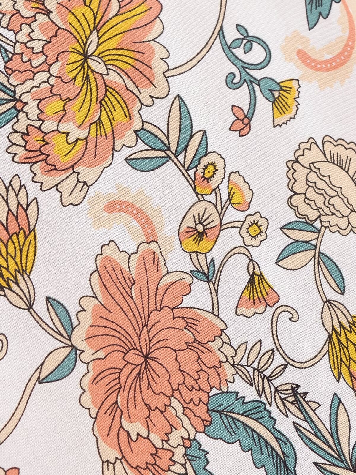 Close-up of Malbusaat long sleeve floral summer dress UK fabric featuring pastel pink yellow and blue flowers