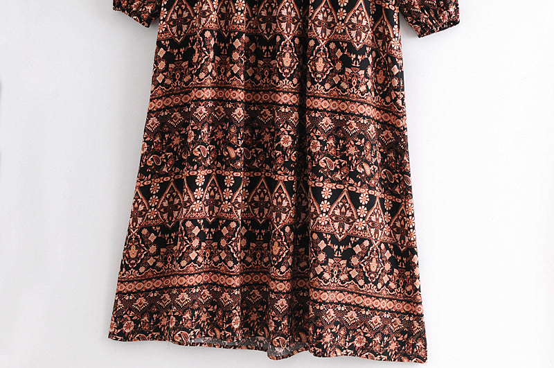 Malbusaat loose fit printed holiday dress with intricate black and brown geometric patterns