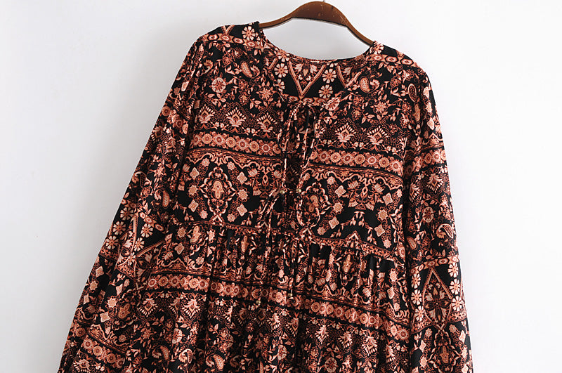 Malbusaat loose fit printed holiday dress with long sleeves and intricate floral patterns