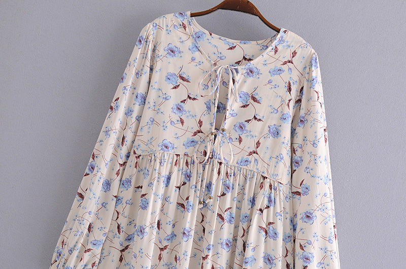 Malbusaat elegant floral maxi dress with light blue and brown flower pattern on cream fabric