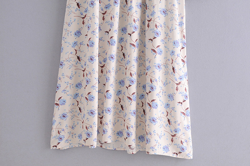 Malbusaat elegant floral maxi dress with blue and brown flowers on cream fabric