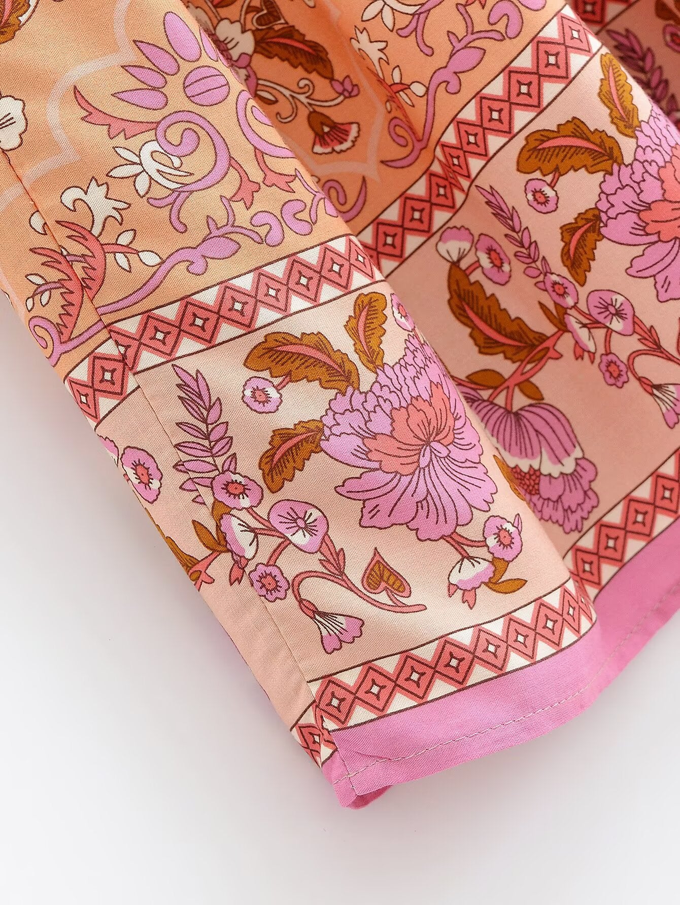 Close-up of Malbusaat elastic waist floral skirt UK featuring pink and peach floral patterns with decorative borders