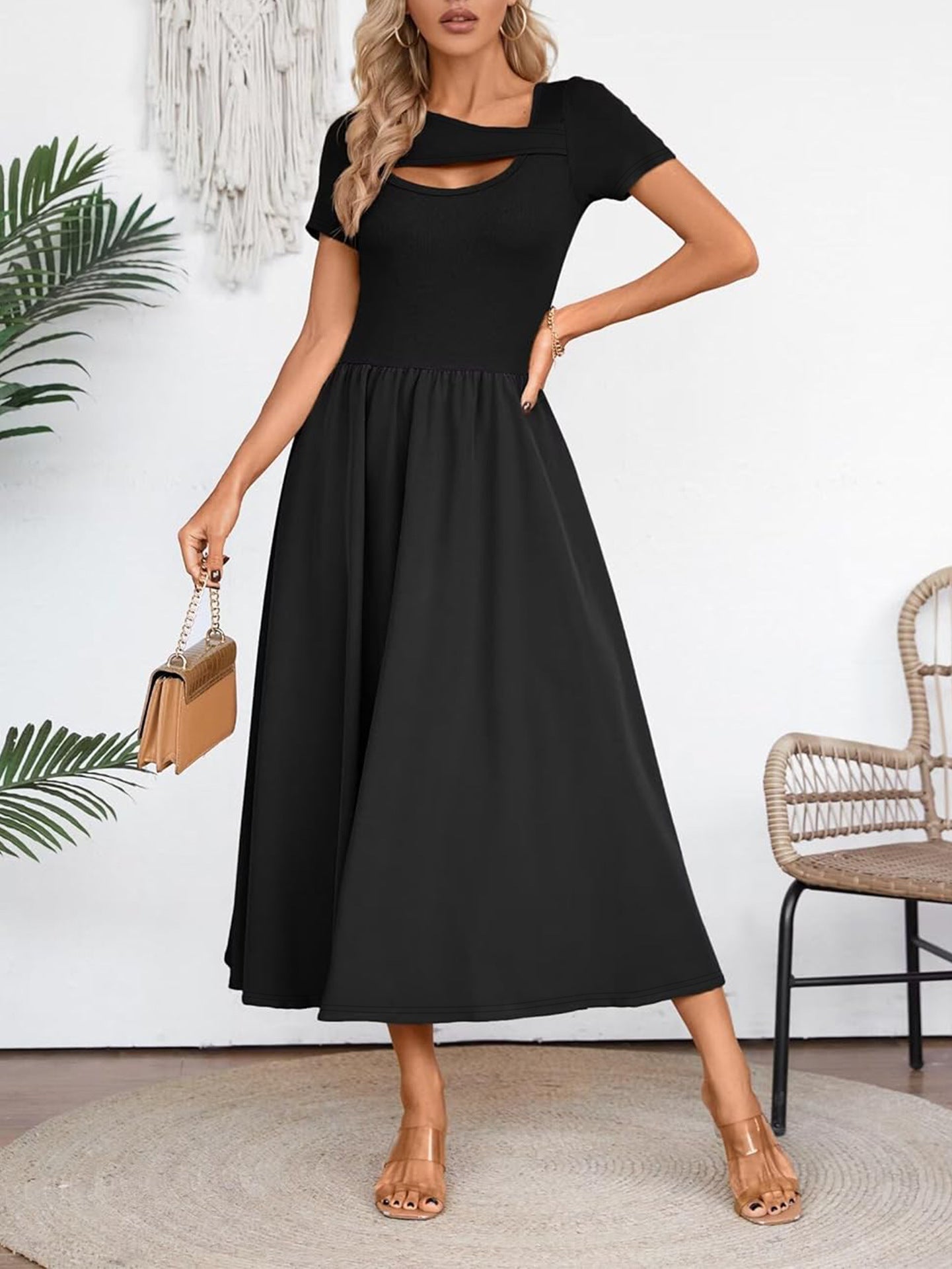 Malbusaat elegant black midi dress for summer with short sleeves and cut-out detail