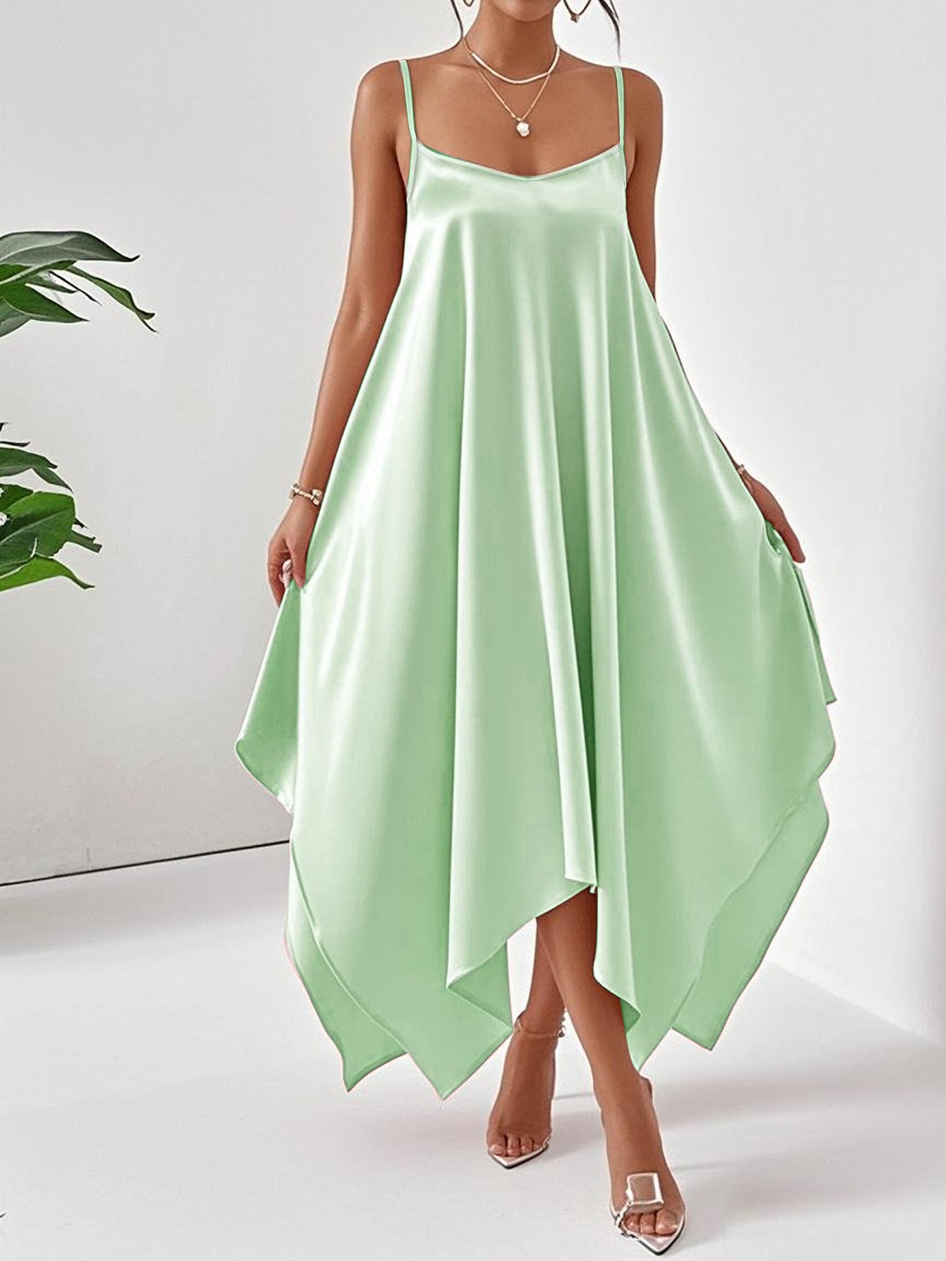 Elegant long sling dress for women in mint green satin with asymmetrical hem and spaghetti straps