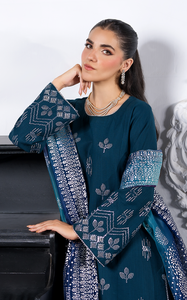 Emerald Dream Khaddar Embroidered Suit showcased by a model with intricate embroidery and stylish sleeves