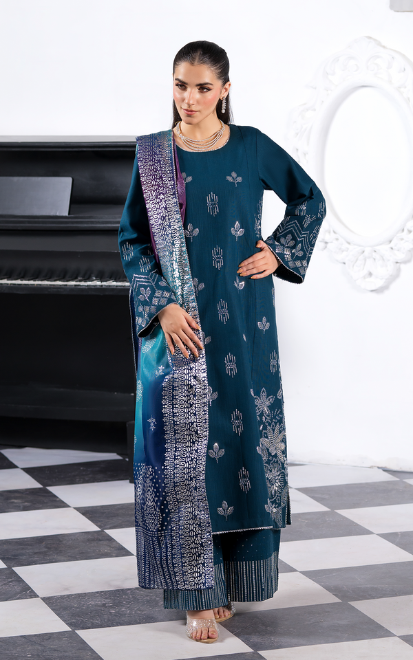 Elegant model showcasing the Emerald Dream Khaddar Embroidered Suit with intricate designs and matching dupatta