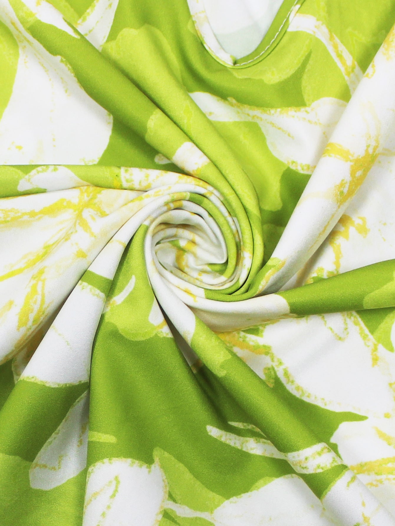 Close-up of green and white fabric pattern for short sleeved ladies jumpsuit outfit by Malbusaat