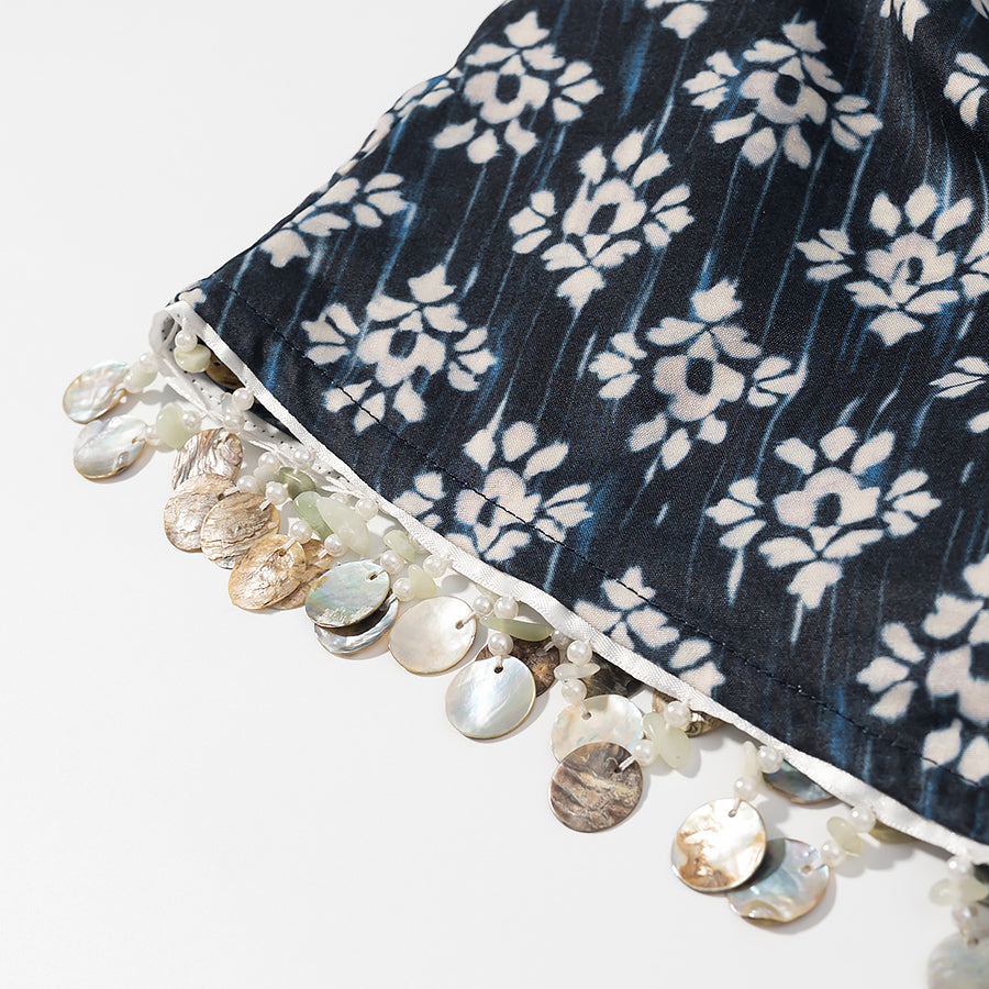 Close-up of Malbusaat fashionable beaded skirts for women with floral pattern and decorative bead embellishments