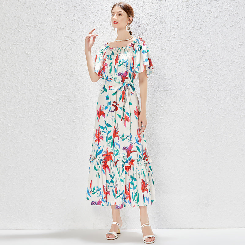 malbusaat floral maxi dress UK with colourful flower print and tie waist worn by model