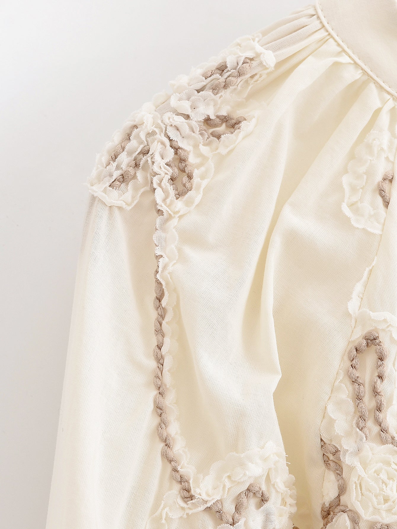 Cream floral mini shirt for women with intricate lace detailing by Malbusaat