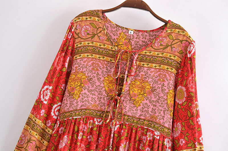Malbusaat spring long sleeve maxi dress with vibrant floral patterns and tie neckline on hanger