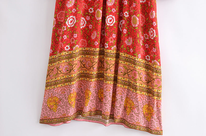 Colourful floral patterned spring long sleeve maxi dress with intricate border design