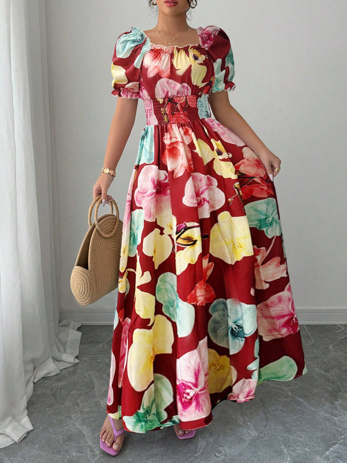 Floral Square Neck Maxi Dress with Puff Sleeves in vibrant multicolour floral print worn with straw handbag