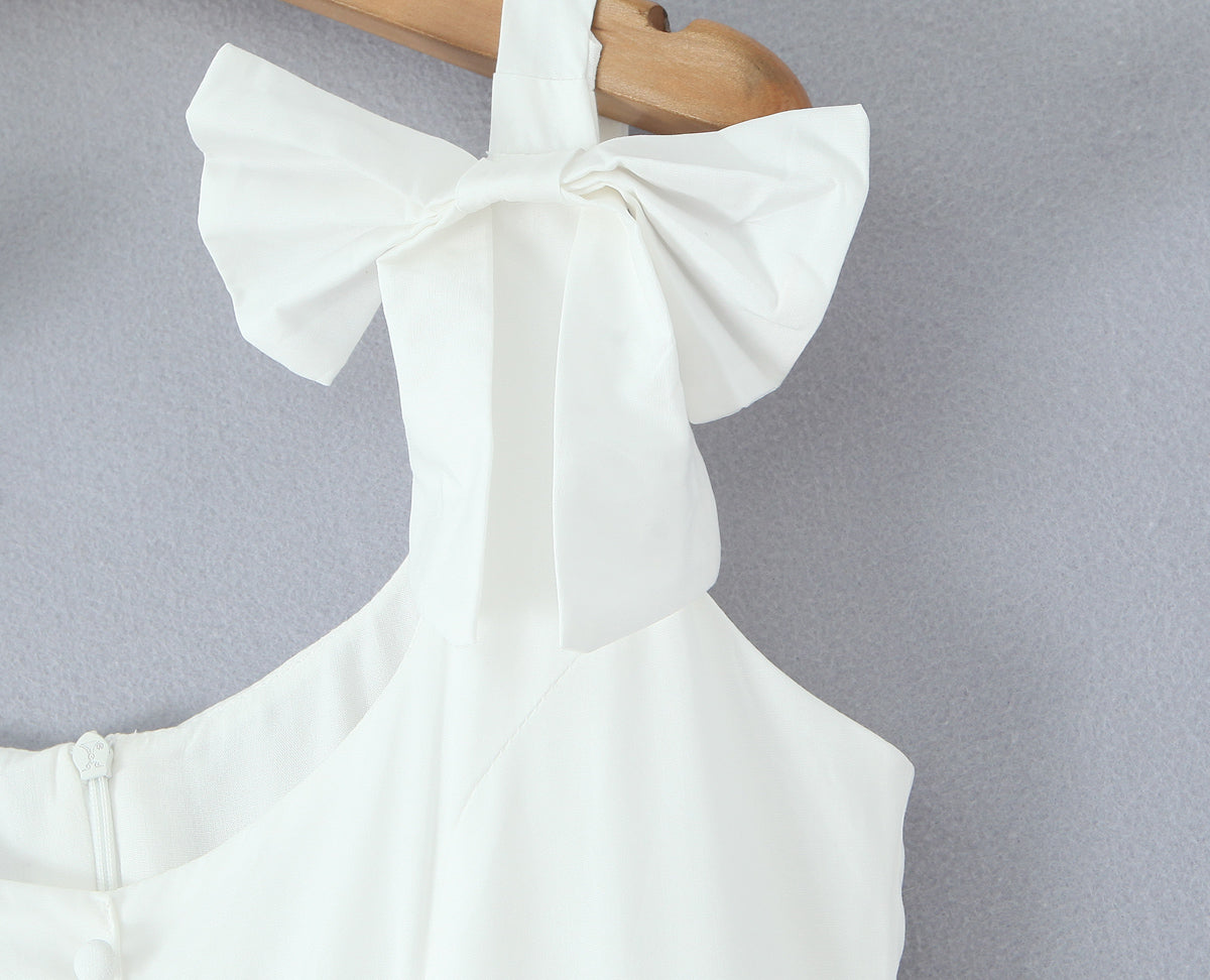 Malbusaat white French bowknot spaghetti dress close up of shoulder bow strap and bodice with zip