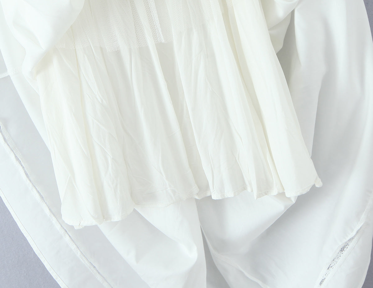 Malbusaat white sheer layered French bowknot spaghetti dress close up showing pleated chiffon hem and delicate fabric