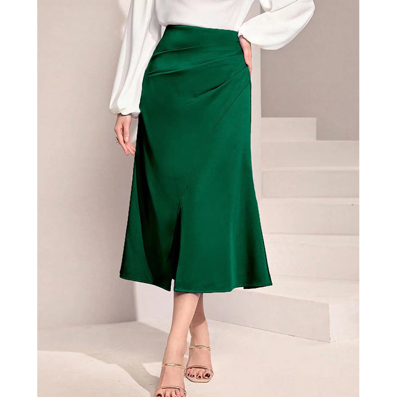Green high waist satin skirt by Malbusaat with a front slit and elegant draped detail