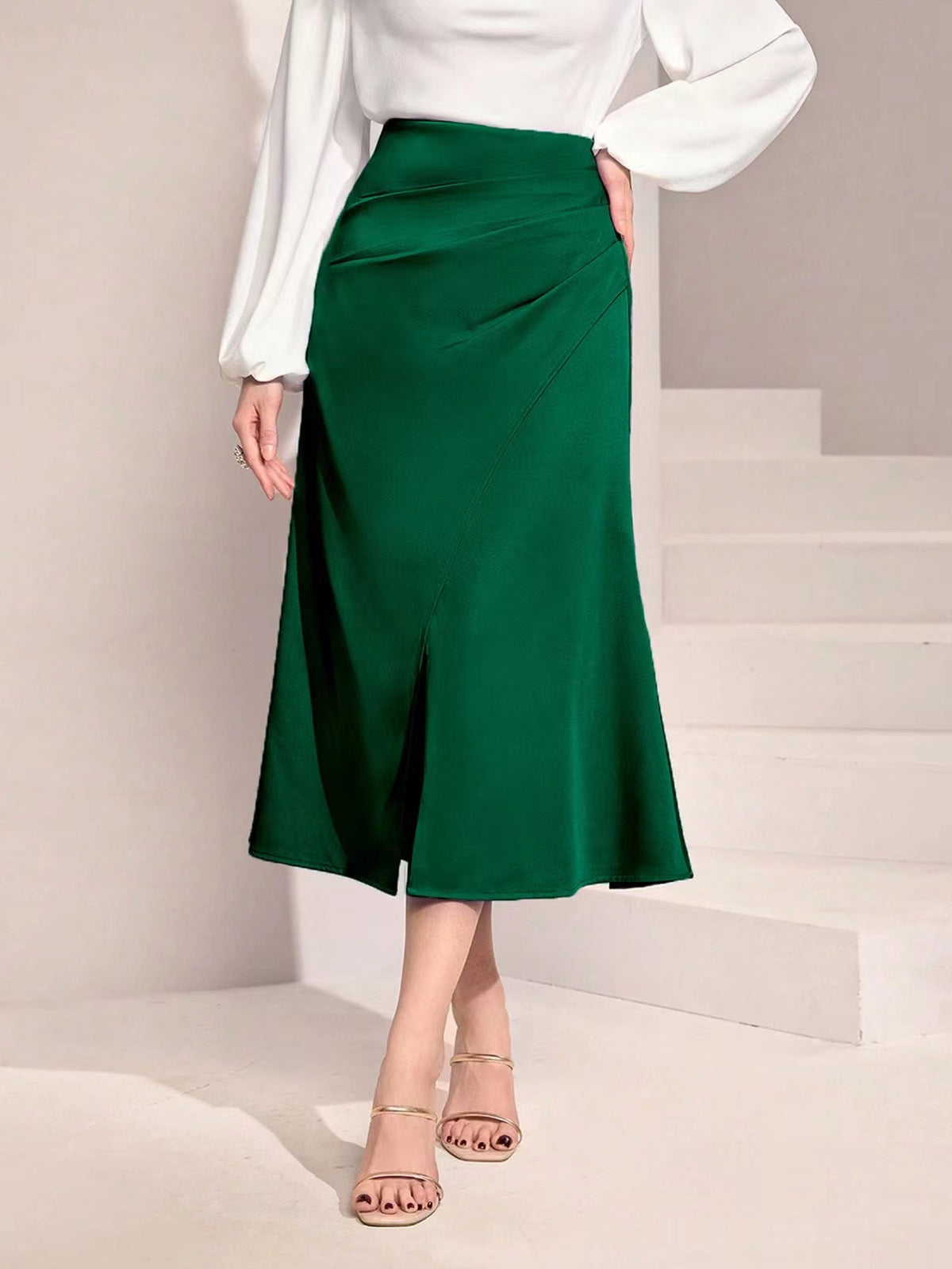 Malbusaat high waist satin skirt in emerald green with a front slit and smooth finish