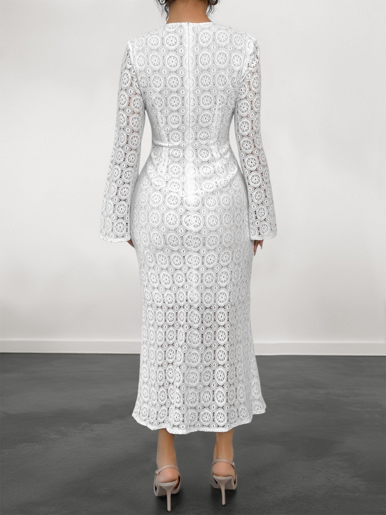 Malbusaat white lace fishtail dress back view with long sleeves fitted waist and midi hem