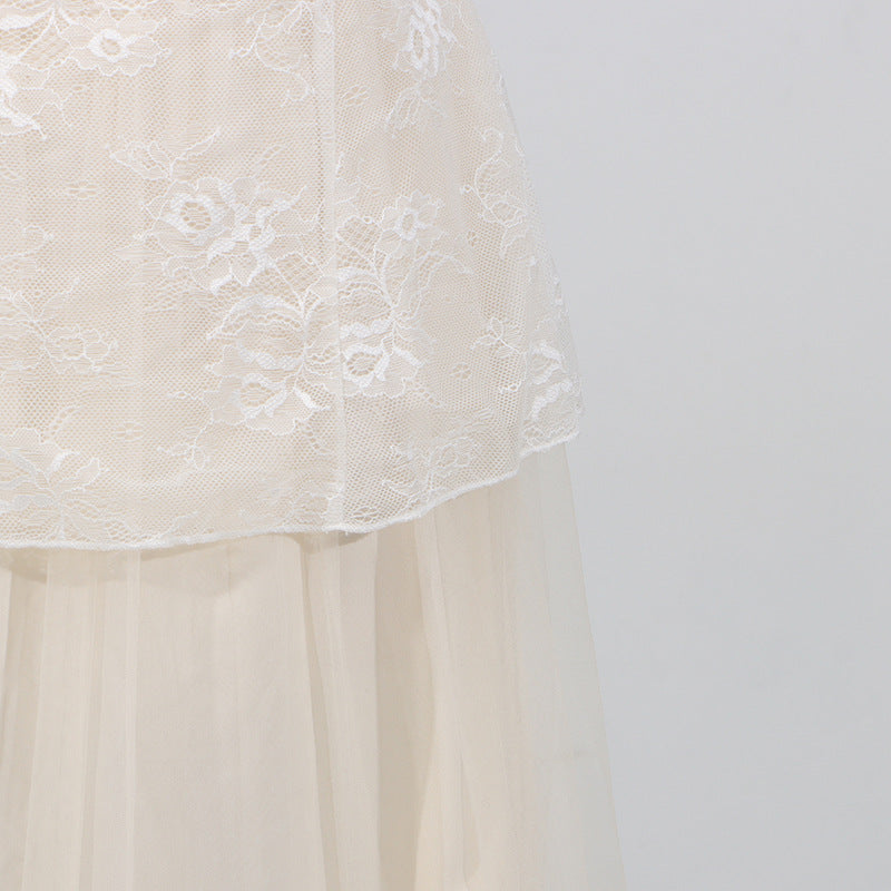 Close-up of white Lace Mesh Embroidered Sleeveless Maxi showcasing delicate floral embroidery and sheer fabric