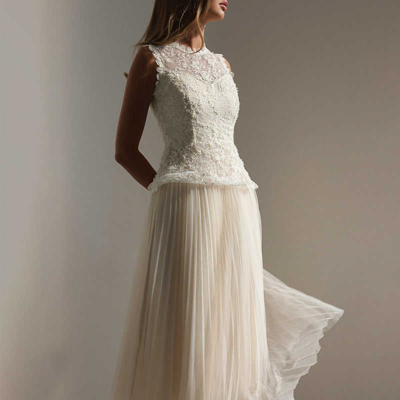 Malbusaat Lace Mesh Embroidered Sleeveless Maxi dress with intricate floral embroidery and flowing pleated skirt