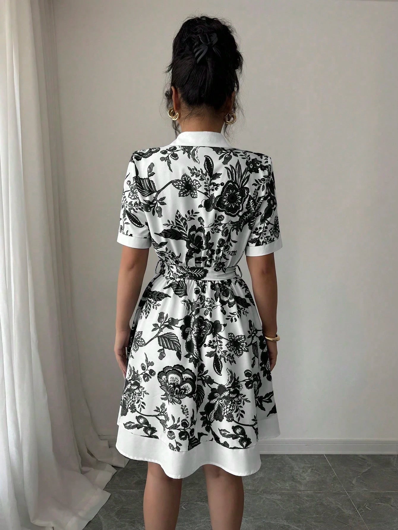 Malbusaat black and white floral lace up waist midi dress with short sleeves and A line skirt