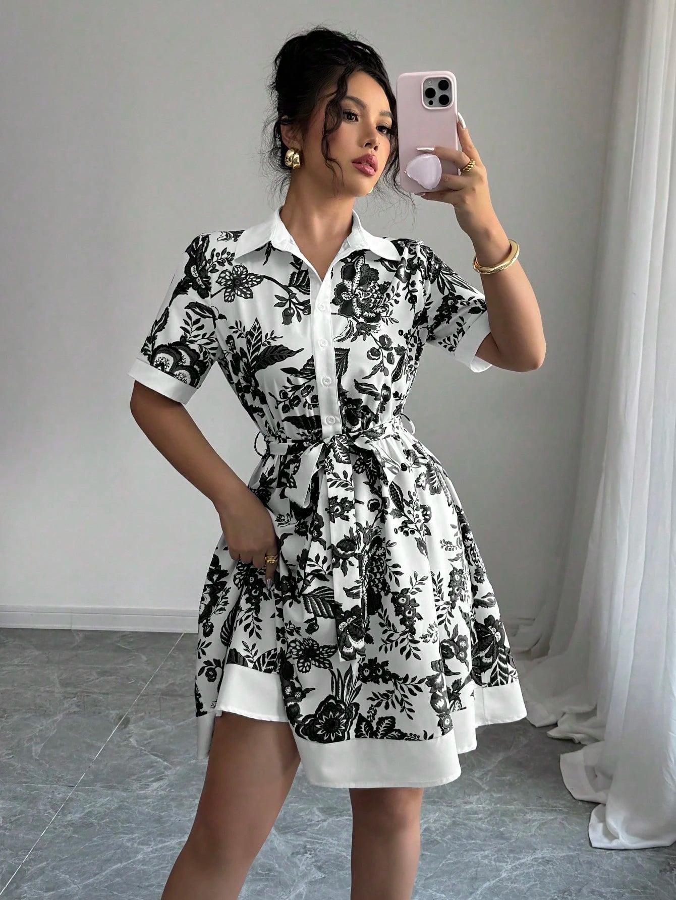 Malbusaat lace up waist midi dress in white with black floral A-line pattern and short sleeves