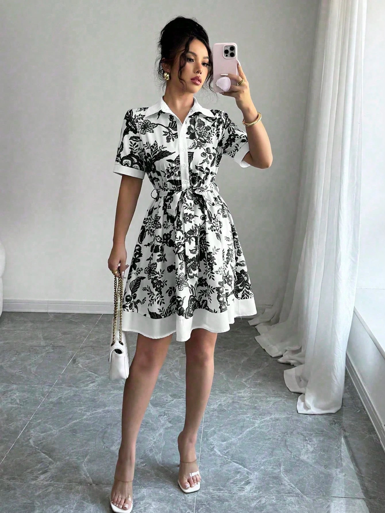 Malbusaat black and white floral lace up waist midi dress with short sleeves and A-line skirt