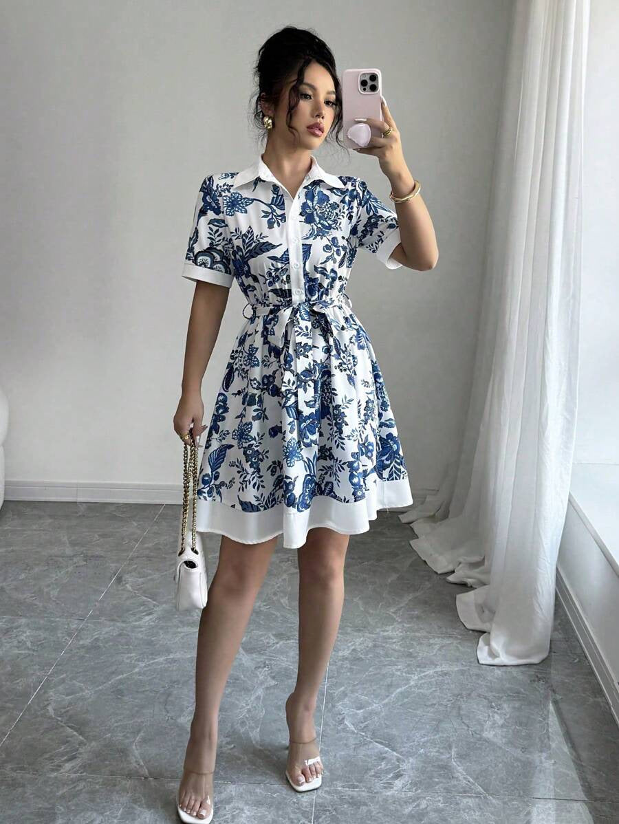 Malbusaat lace up waist midi dress in white with blue floral print and A-line silhouette