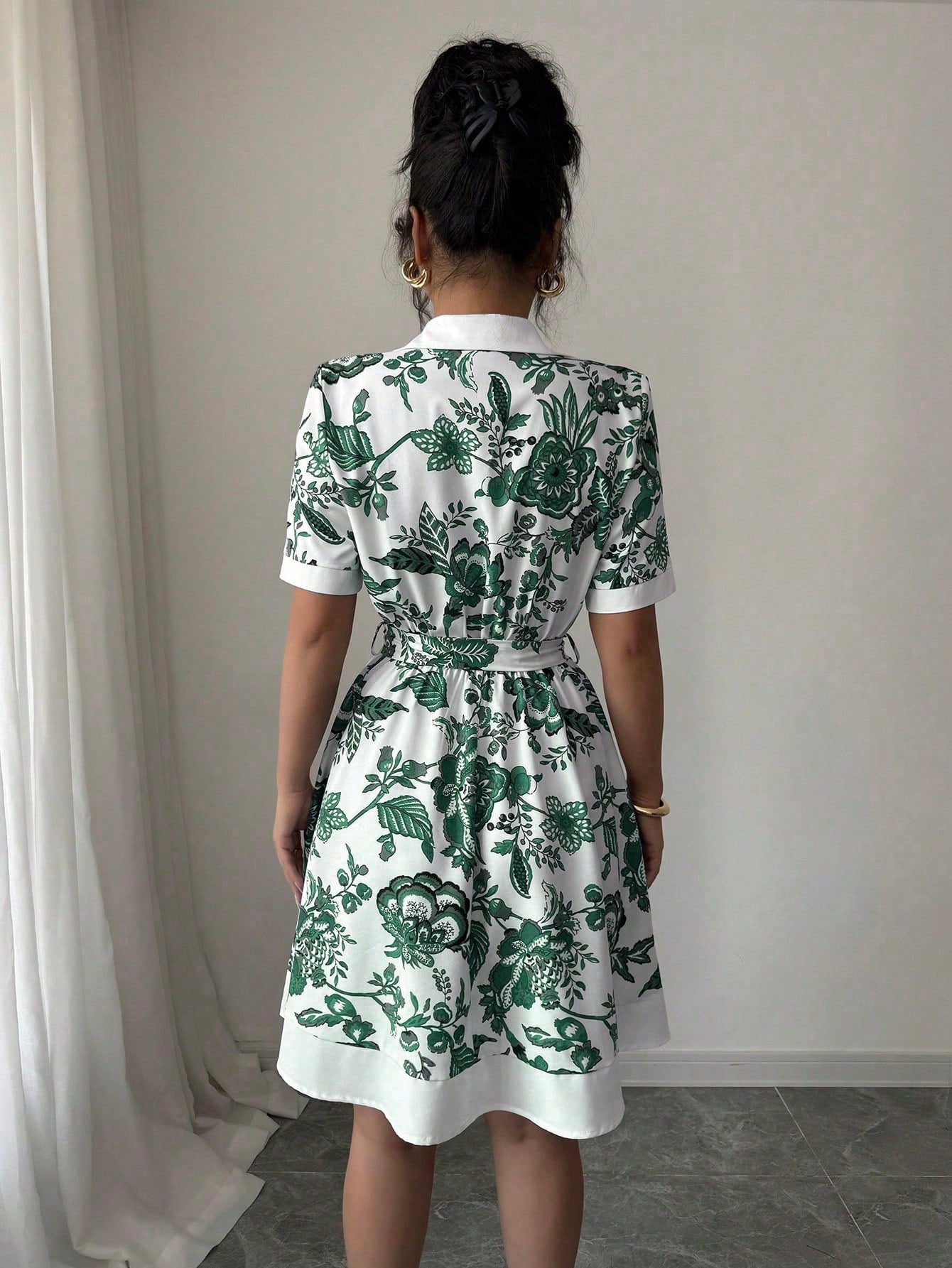 Malbusaat lace up waist midi dress with green floral print in a comfortable A line style